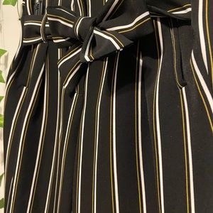 Black trousers with yellow & white strips. Barely worn - great condition!